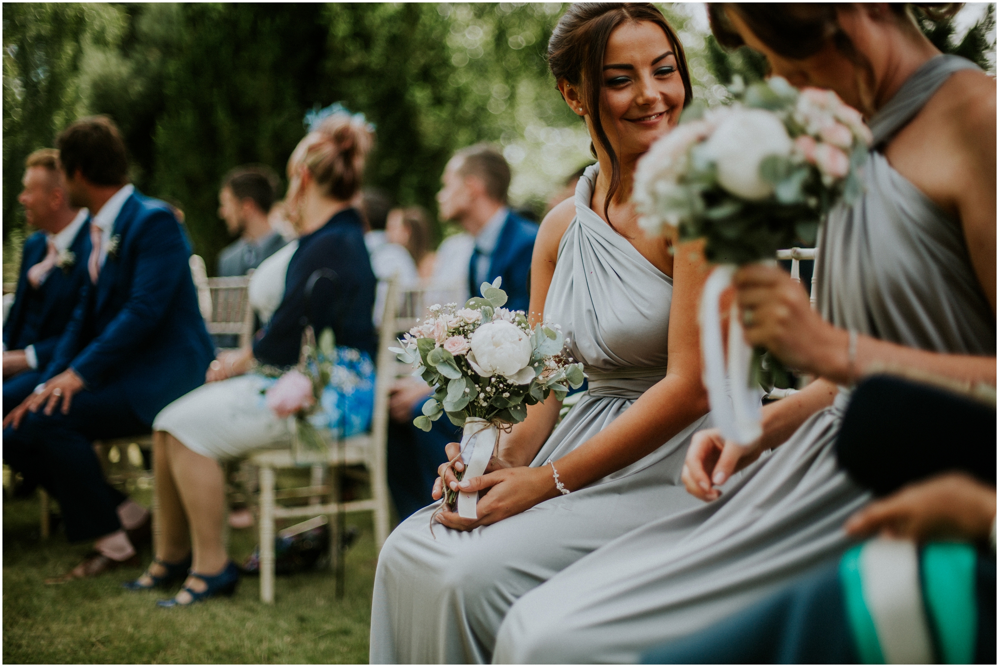 bridesmaid smiling outdoor wedding ceremony