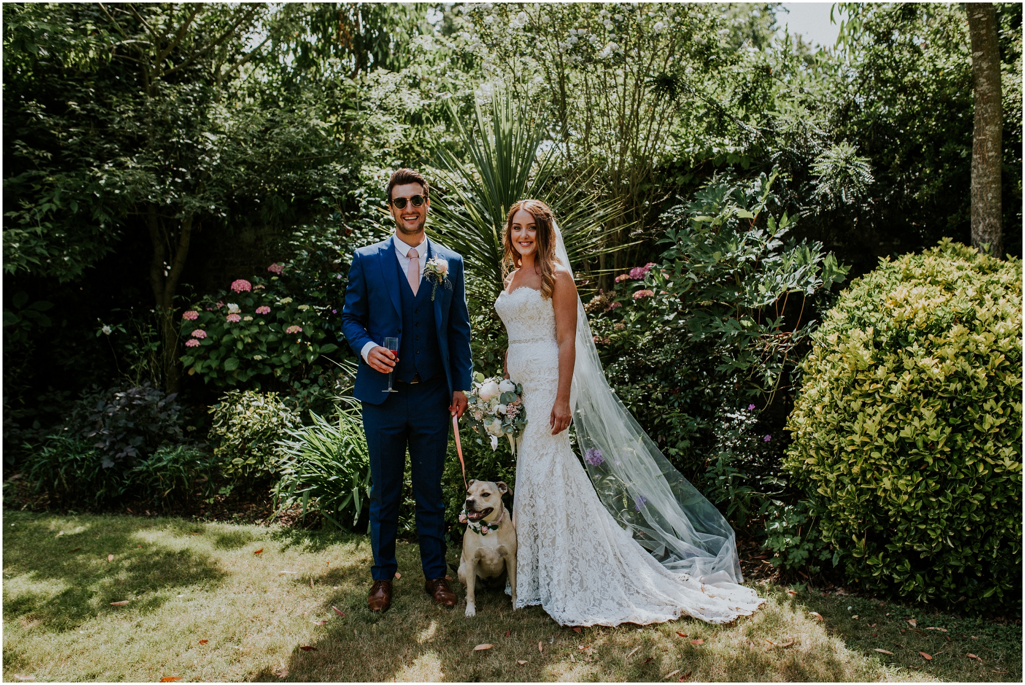 bride and groom with thier dog