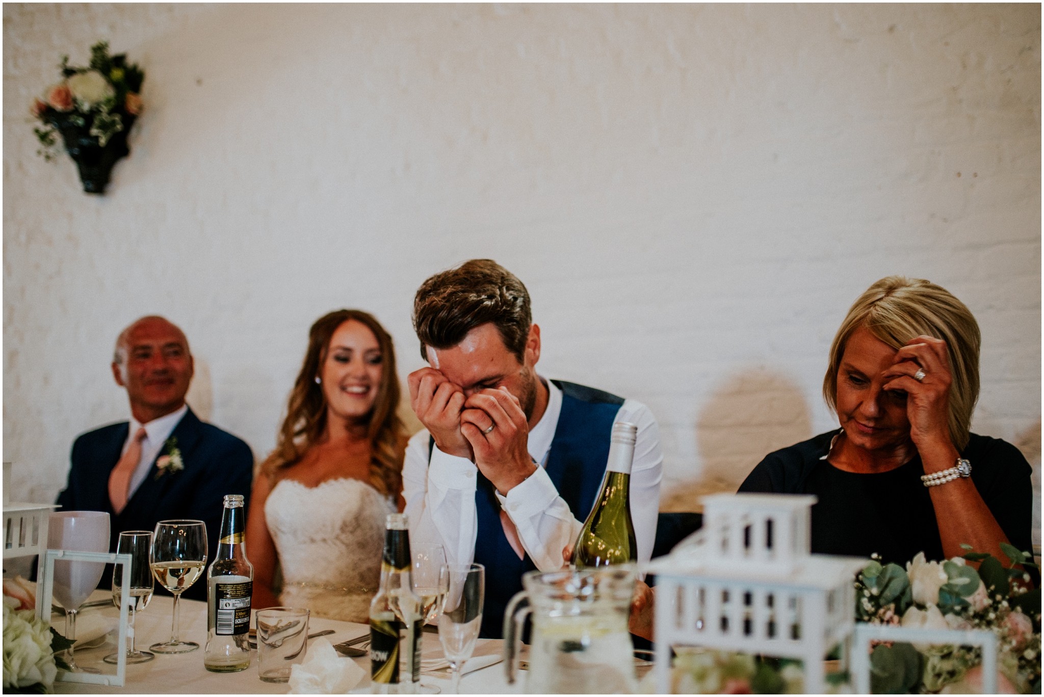 groom looking embarrased during speeches