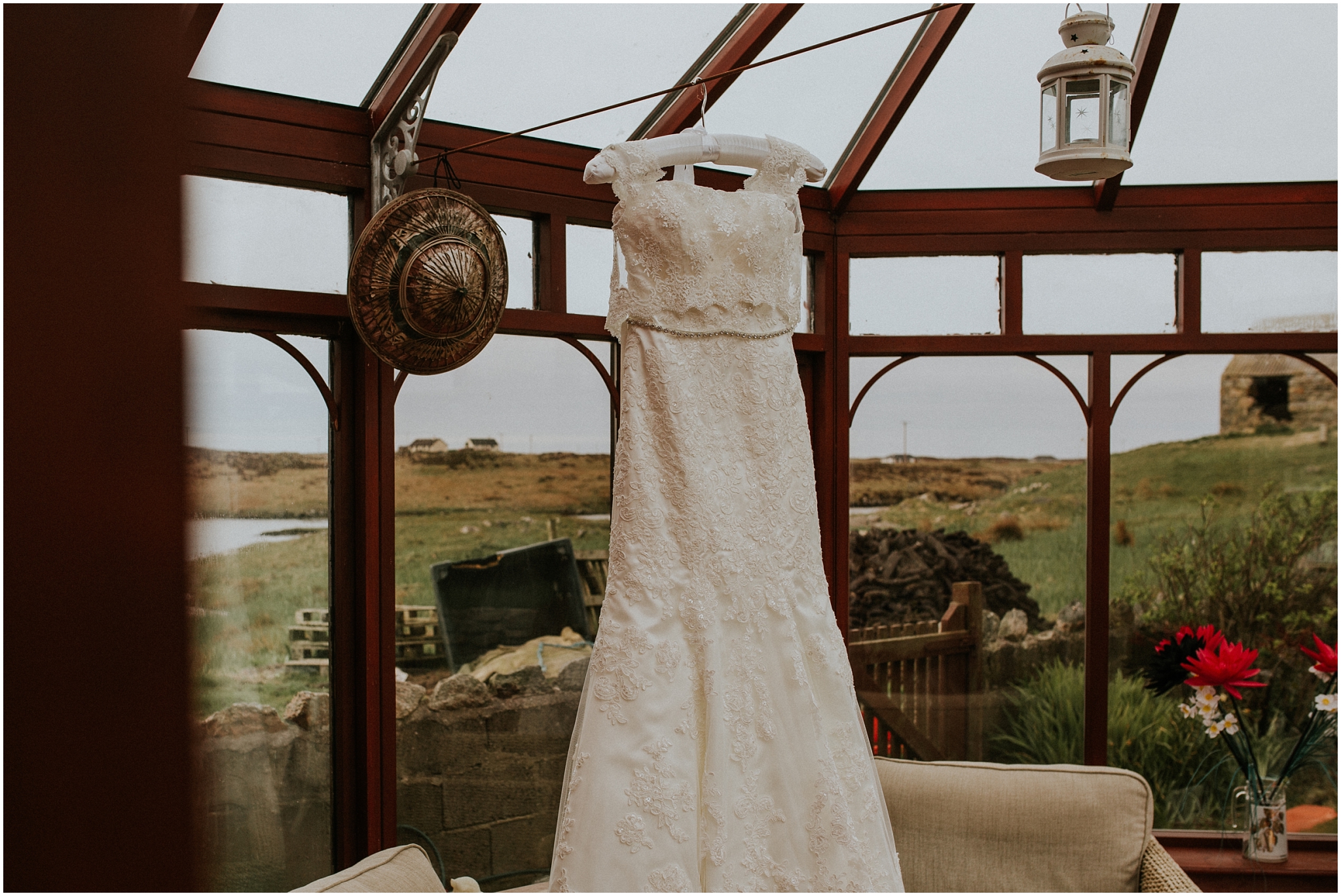 wedding dress hanging in brides conservatory isle of benbecula