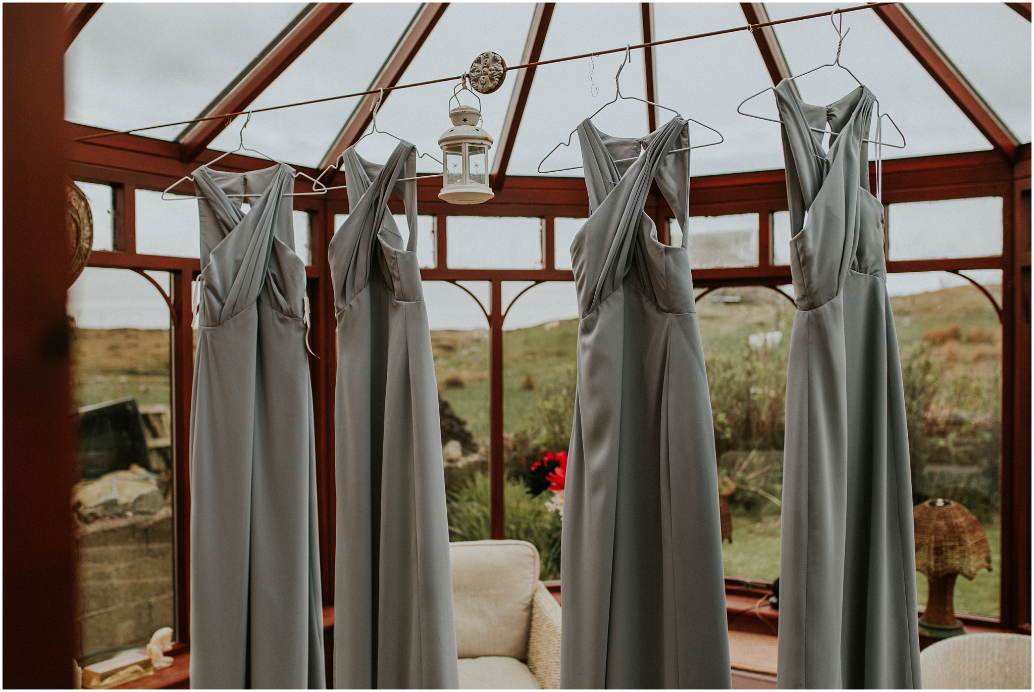bridesmaids dresses hanging in conservatory benbecula wedding