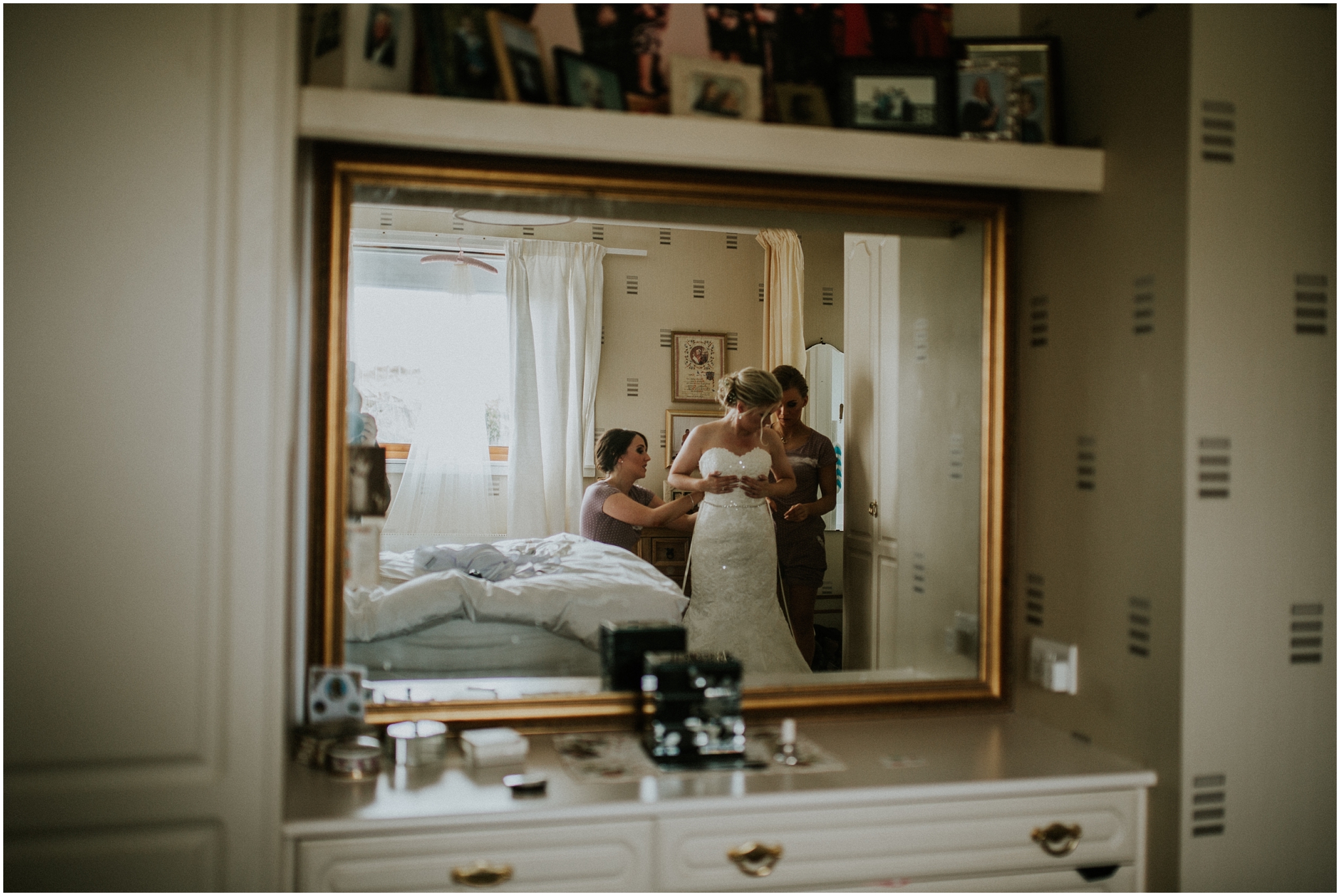 bride getting ready in mirror