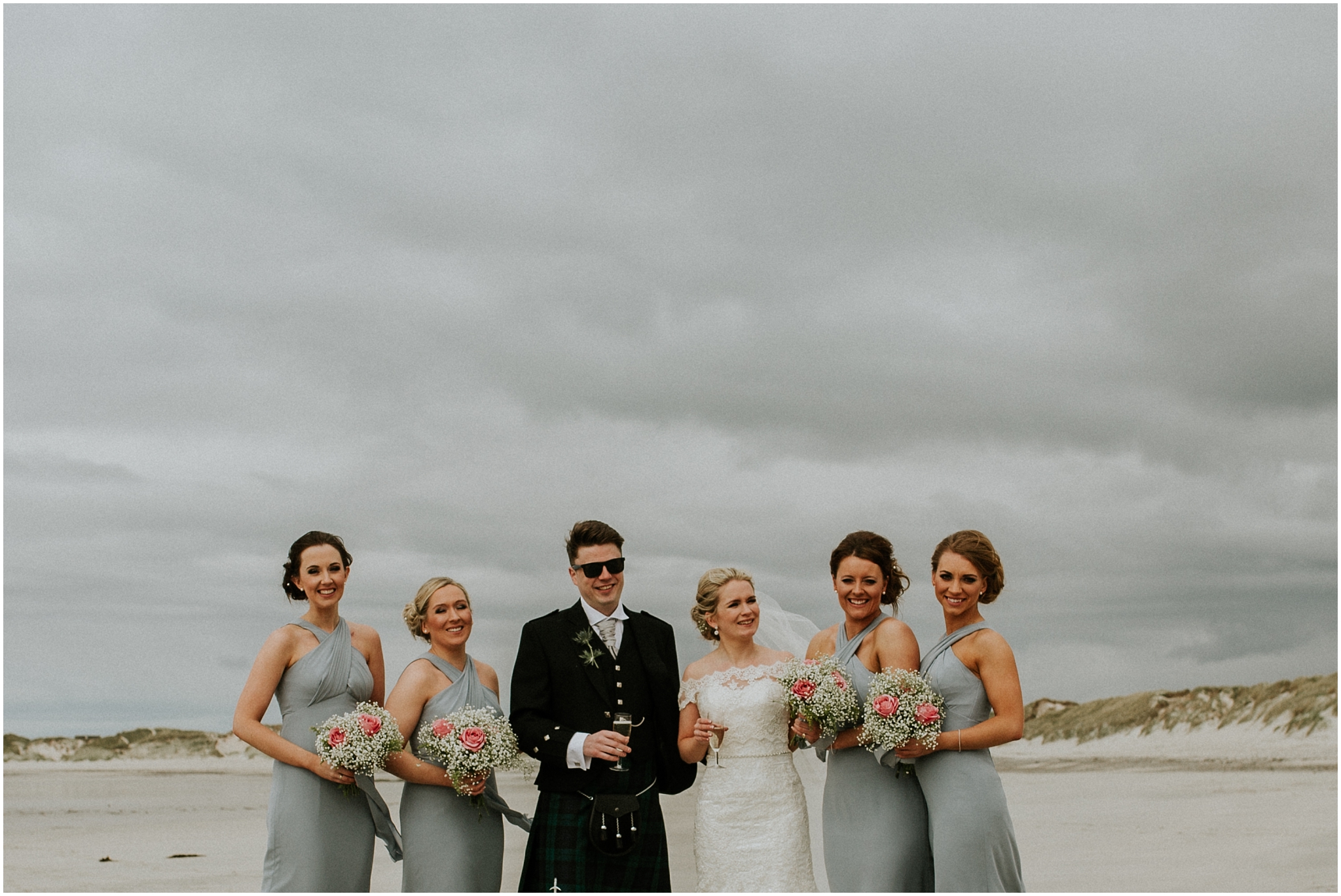 bridal party on the beach