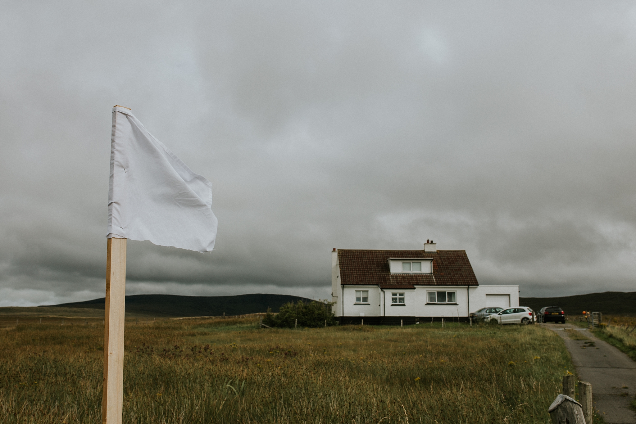 White flag outside house in North Uist, Wedding Day