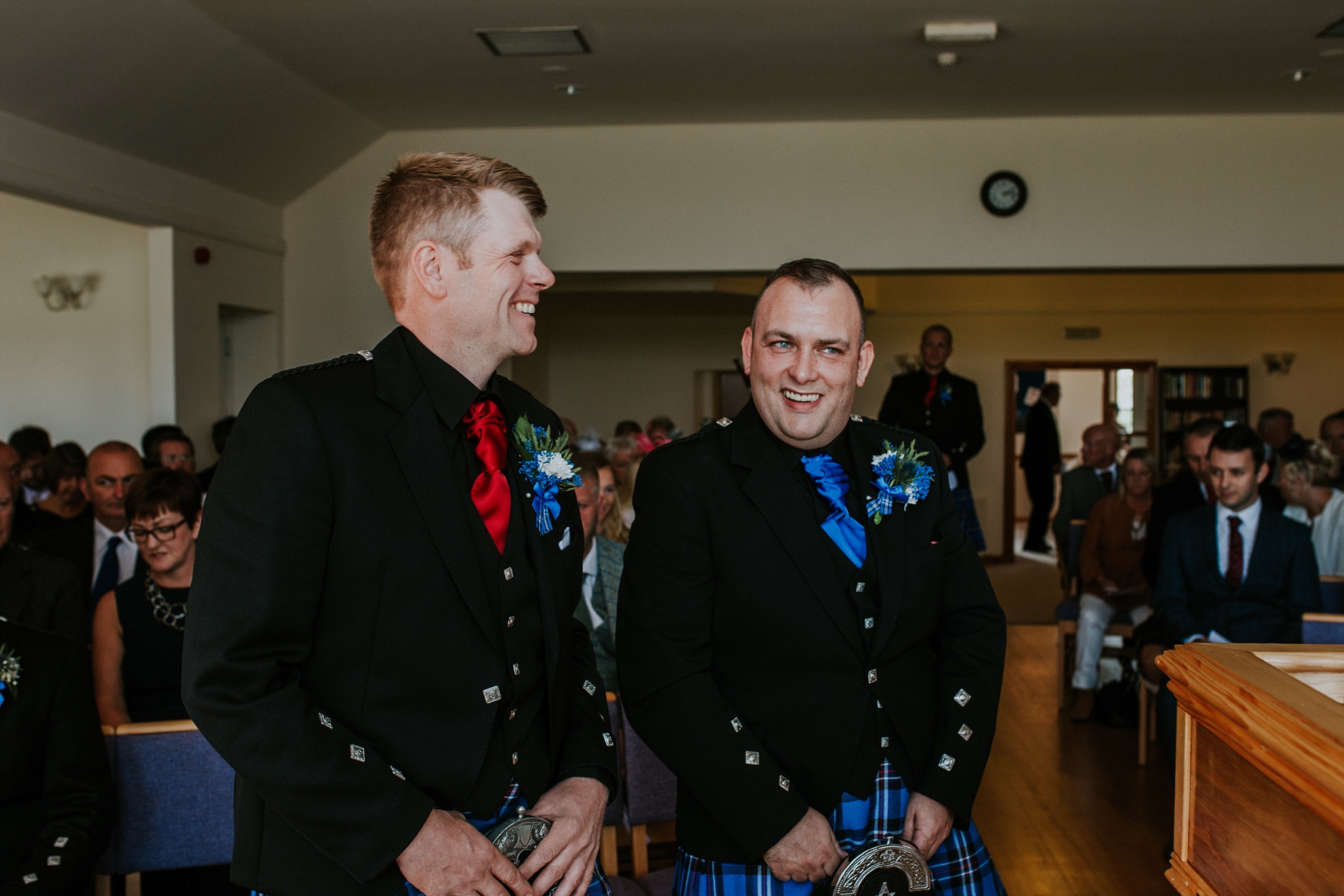 Groom and best man laughing in the church, Carnish, North Uist