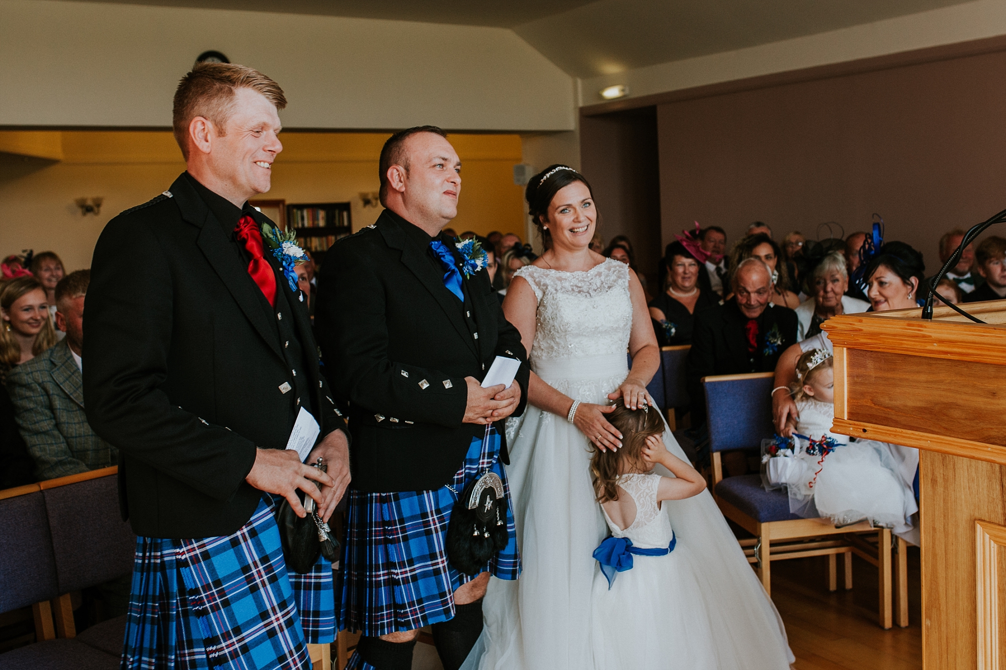 Bride, Groom and Best man laughing in Carnish Free Church