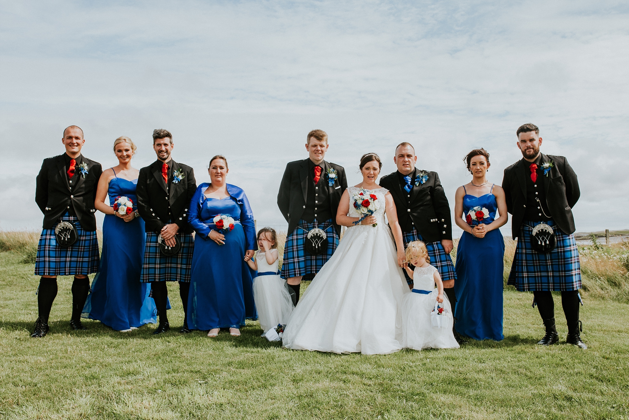 Bridal party group photo outside Carnish Free Church, North Uist