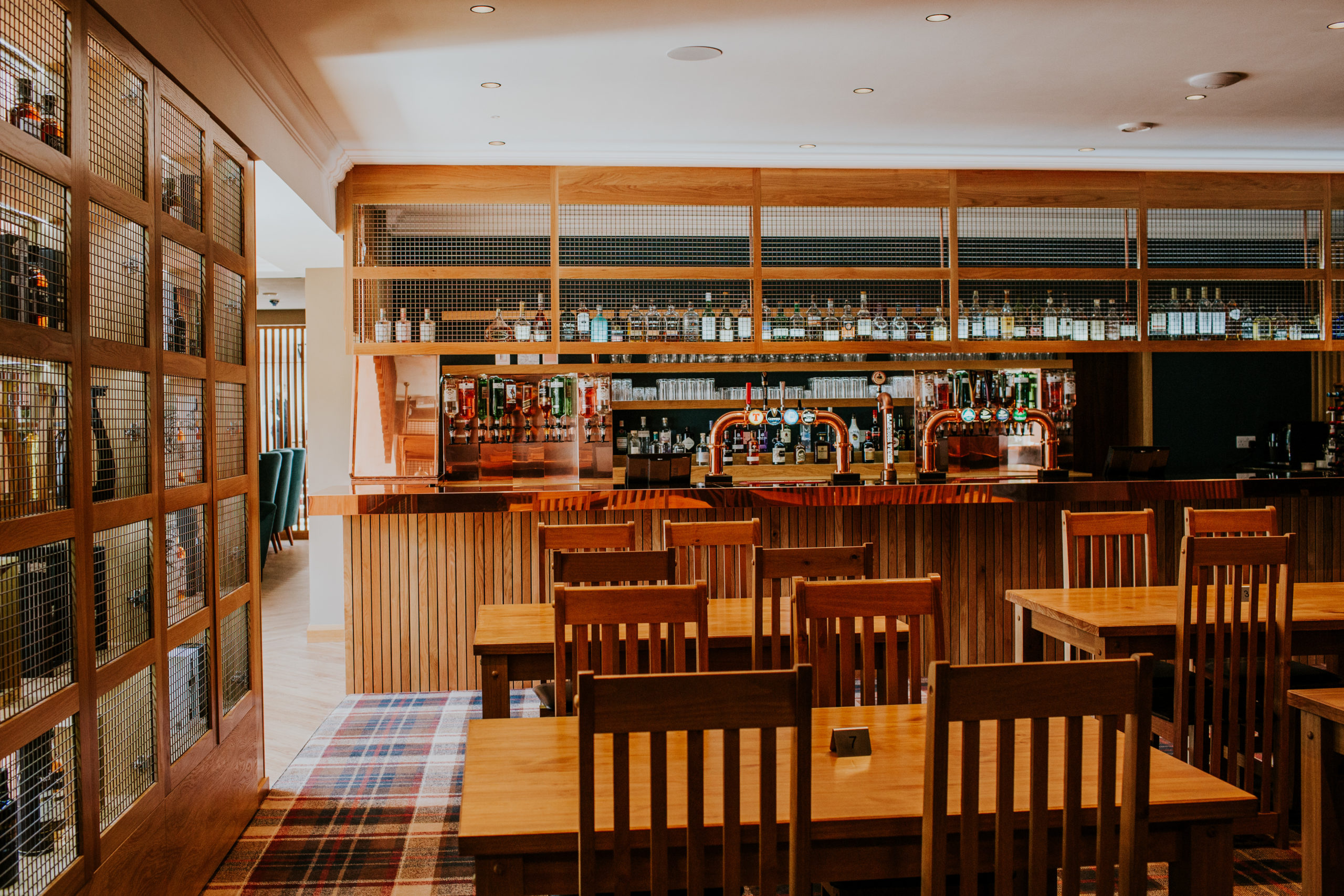 The bar and restaurant area in the Dark Island Hotel on the Isle of Benbecula with a Whisky wall